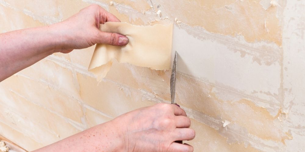Removing old wallpaper backing from the wall