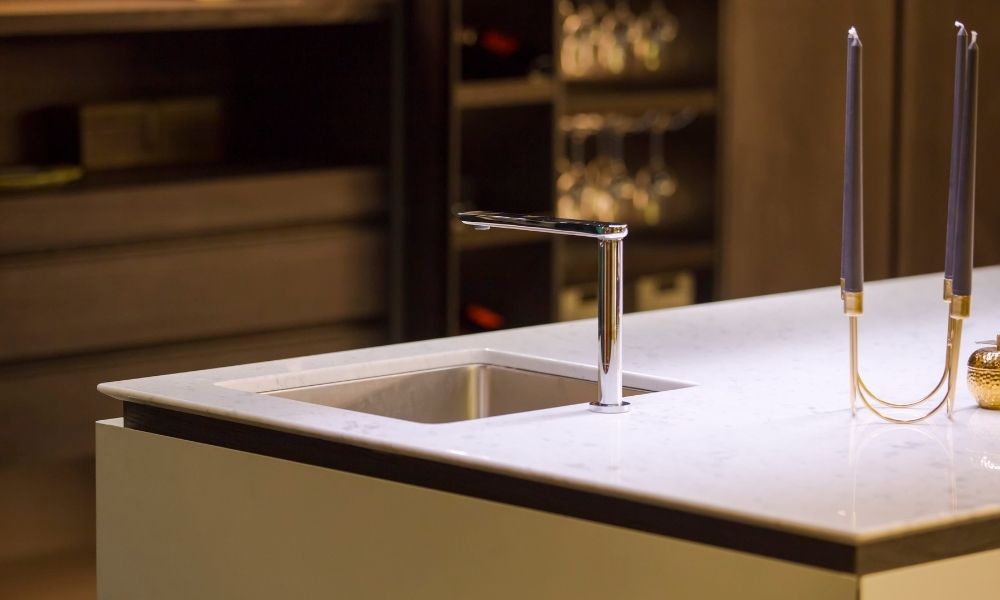 Quartz kitchen island with small stainless steel kitchen sink