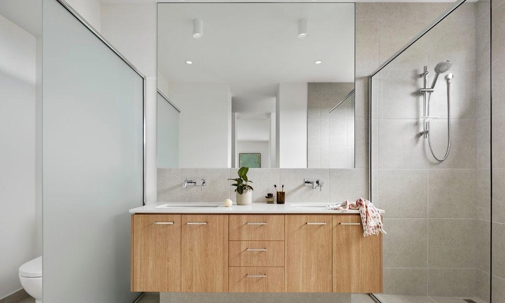 Chic bathroom design with double sinks, quartz bathroom countertop and full length mirror