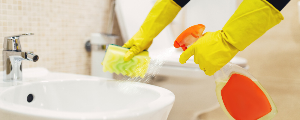 Scrubbing Away Mould from Bathroom Sink