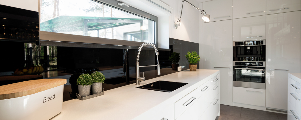White theme kitchen with commercial style kitchen faucet