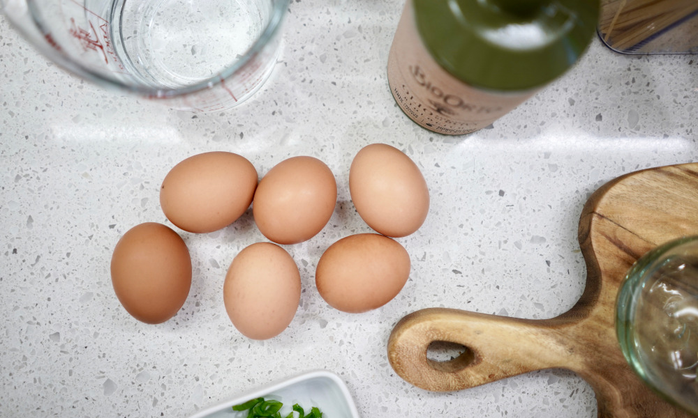 Eggs and wine on pretty terrazzo countertop