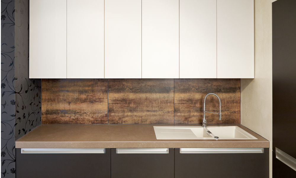 Counter and cabinets in modern kitchen with a timber design backsplash