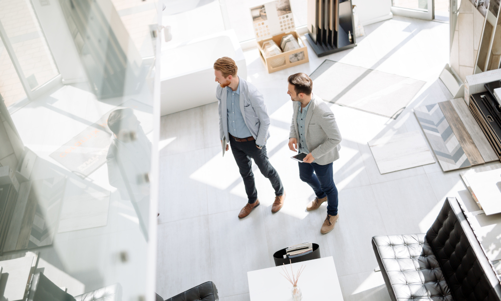 Two handsome customers entering interior design store