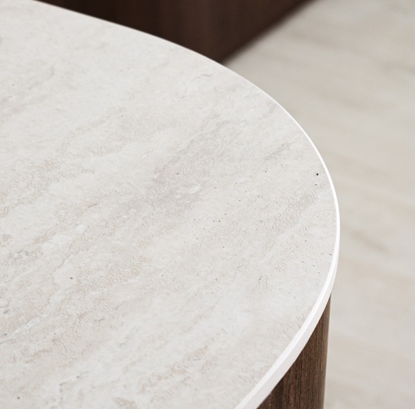Close-up of a polished Aurastone countertop with subtle veining and a soft-rounded edge profile, showcasing premium craftsmanship and finish.