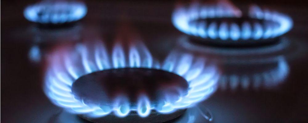 Blue gas flames on kitchen stove