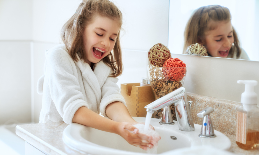 Little girl washing hands for hygienic purposes