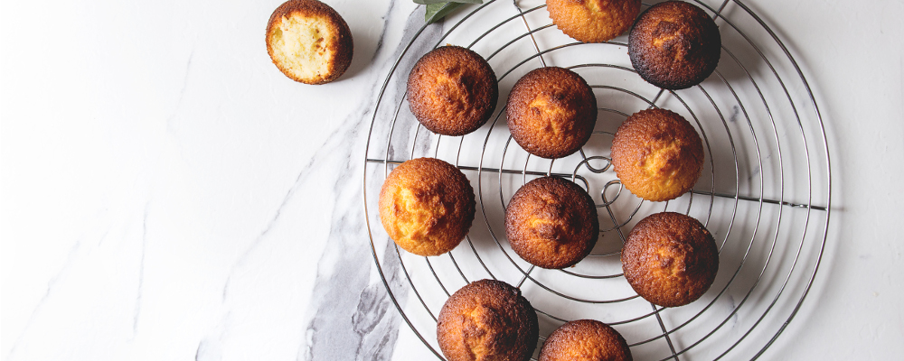 Fresh Muffins from Oven on Marble Kitchen Table