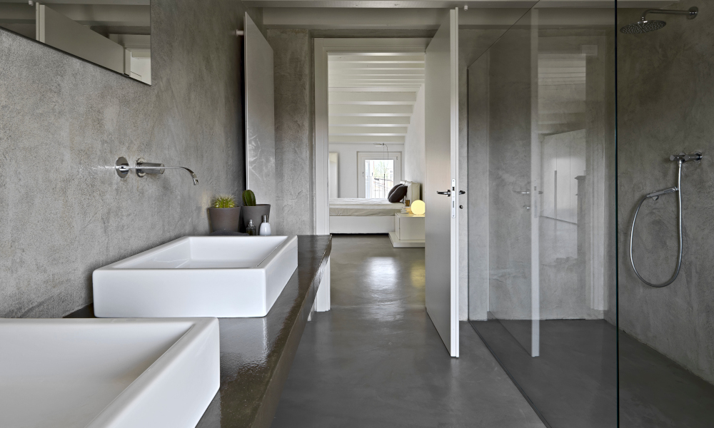 Concrete bathroom countertop and walls with double sinks