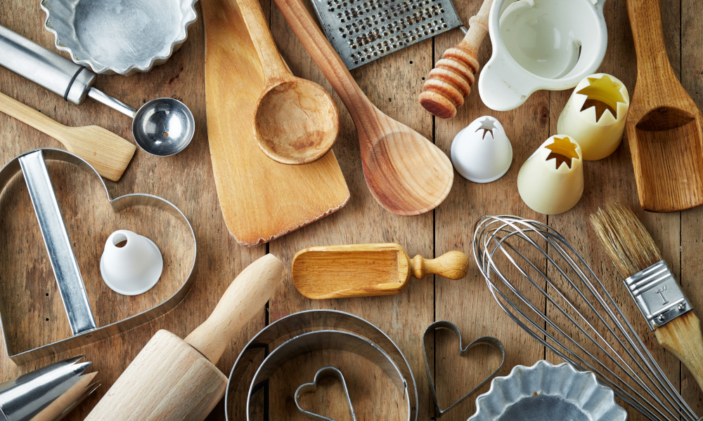 Various kitchen utensils on wooden table