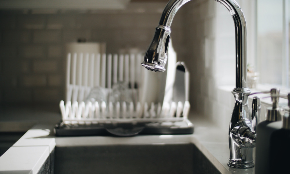 Faucet placement for kitchen sink