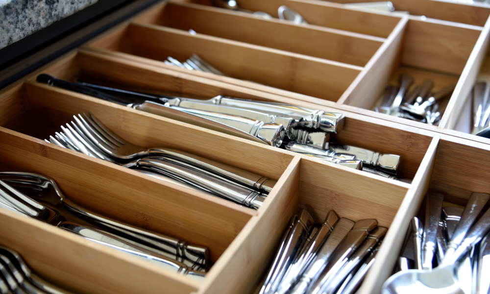 Highly organised kitchen utensils in drawer with dividers
