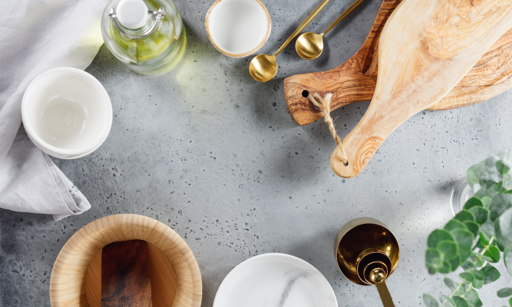 Modern kitchen metal and wooden utensils on a table for cooking