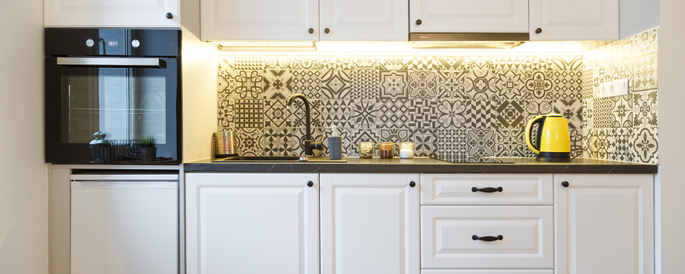 White Kitchen Cabinets with Vintage Tile Backsplash