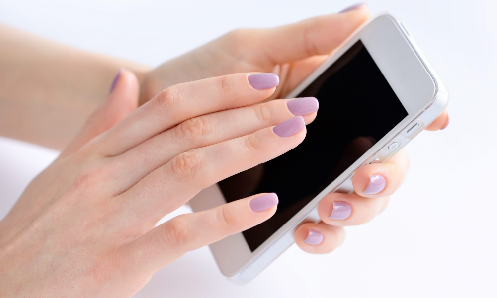 Lady using a white iphone