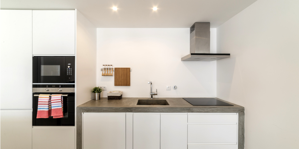 Modern kitchen with gray tile floor and white wall