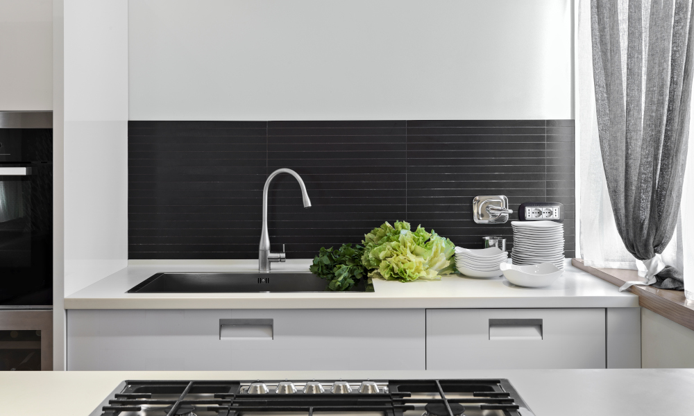 Undermount sink with vegetables on the top in the modern kitchen countertop