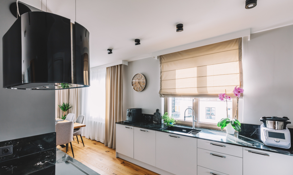 Modern kitchen interior design. Wooden floor and quartz countertop