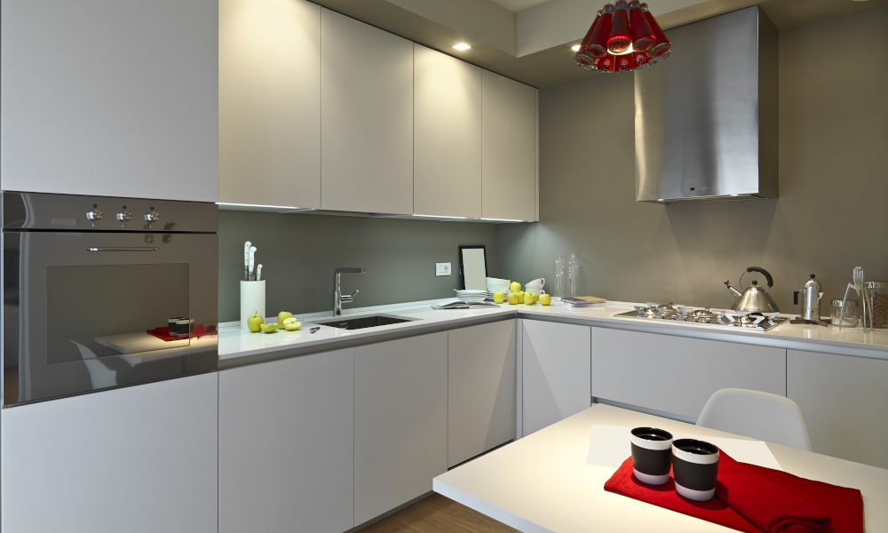 Modern kitchen layout with white cabinets and quartz countertops