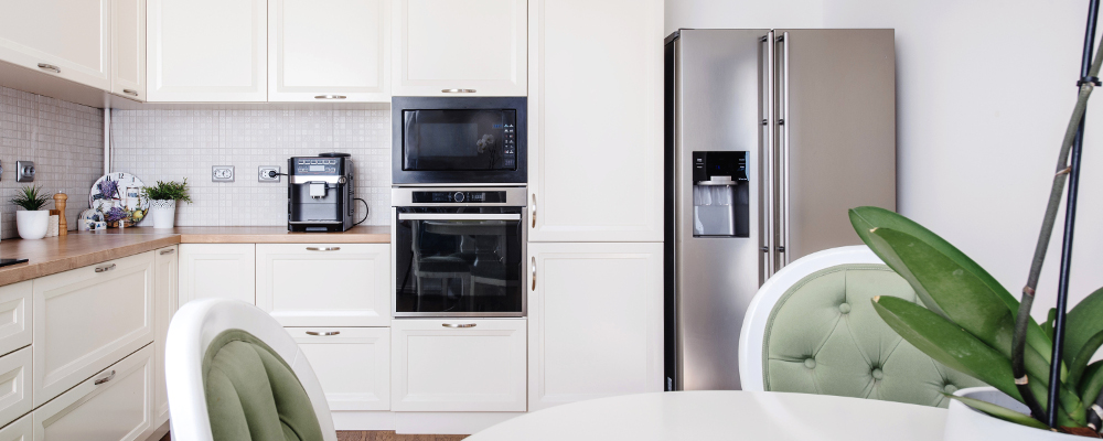 Modern kitchen area and wooden floor with modern energy saving refrigerator