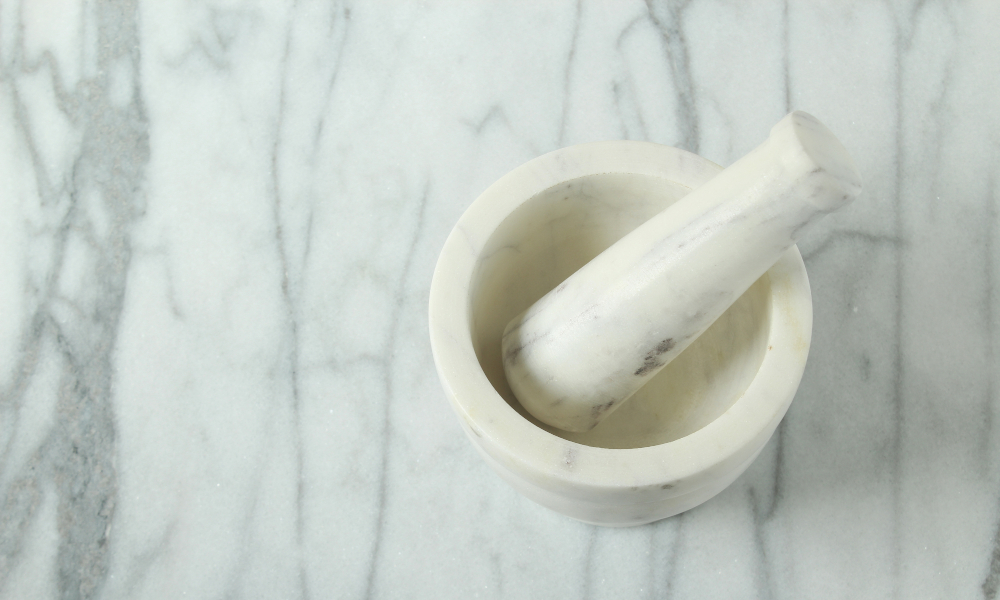 Mortar and pestle on marble countertop