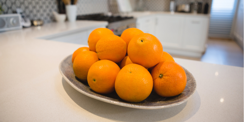 Fresh oranges on the kitchen countertop