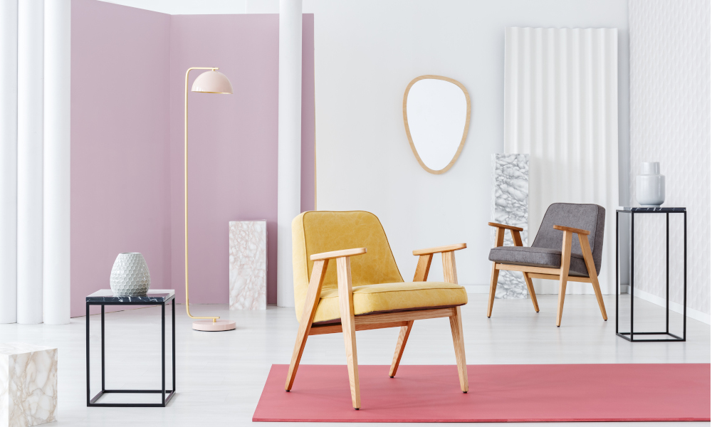 Sleek wooden legged armchairs in the living room