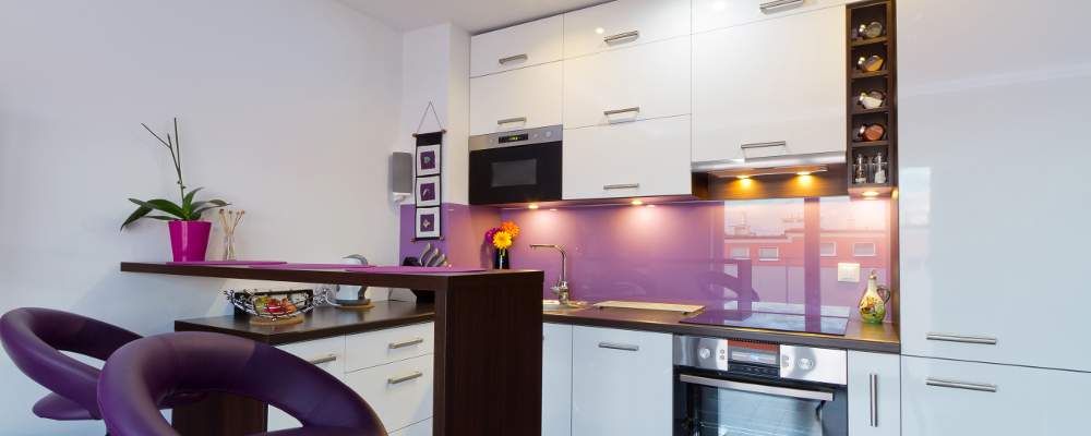Neat and organized modern kitchen in purple and white colour scheme