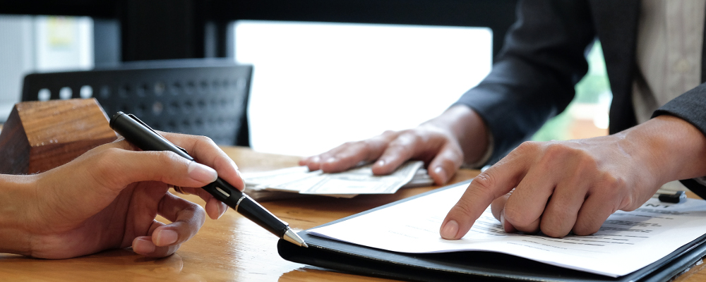 Signing HDB purchase documents with real estate agent and lawyer