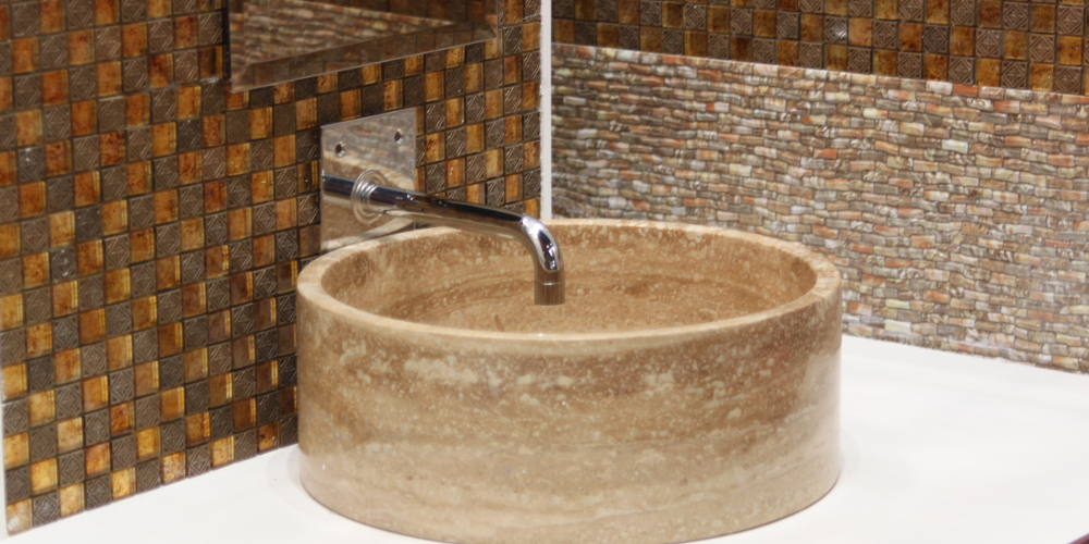 Stone washbasin and chrome tap