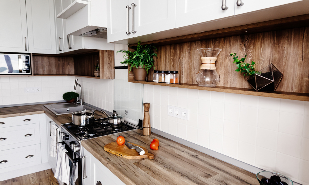 Butcher block wooden countertop with timber wall cabinets