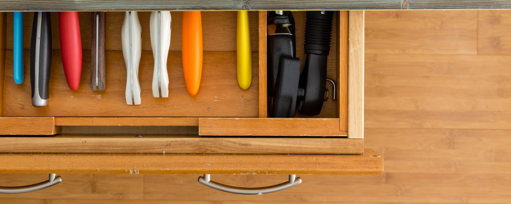 Open wooden tool drawer with segregation of tools
