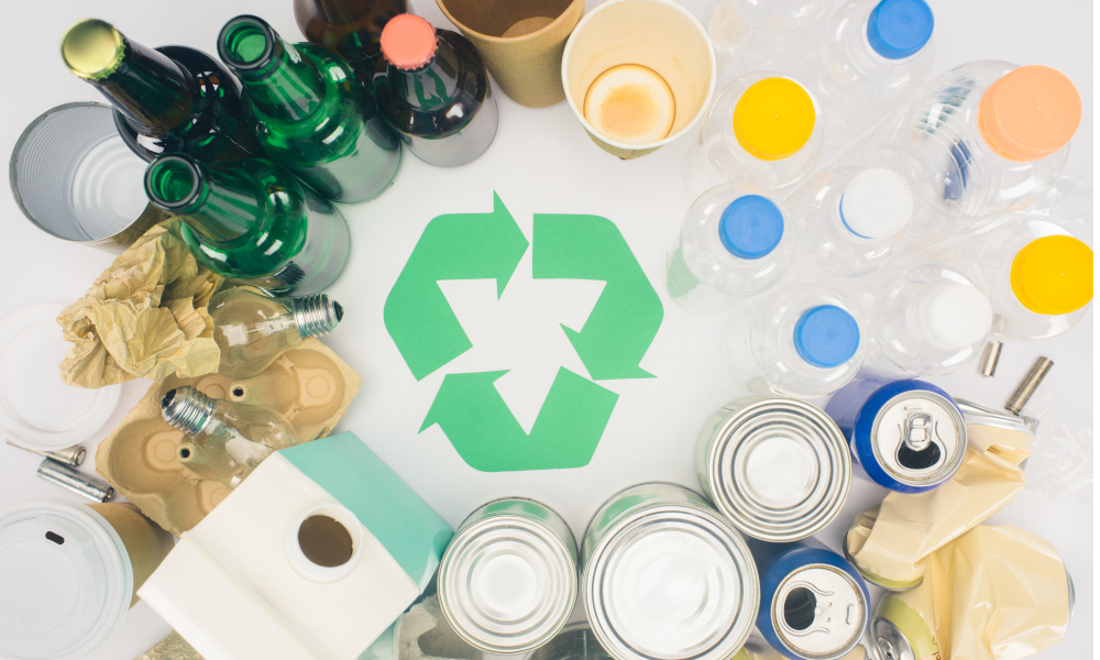 Types of recyclable items - glass bottles, aluminum tins, paper cups, plastic containers 