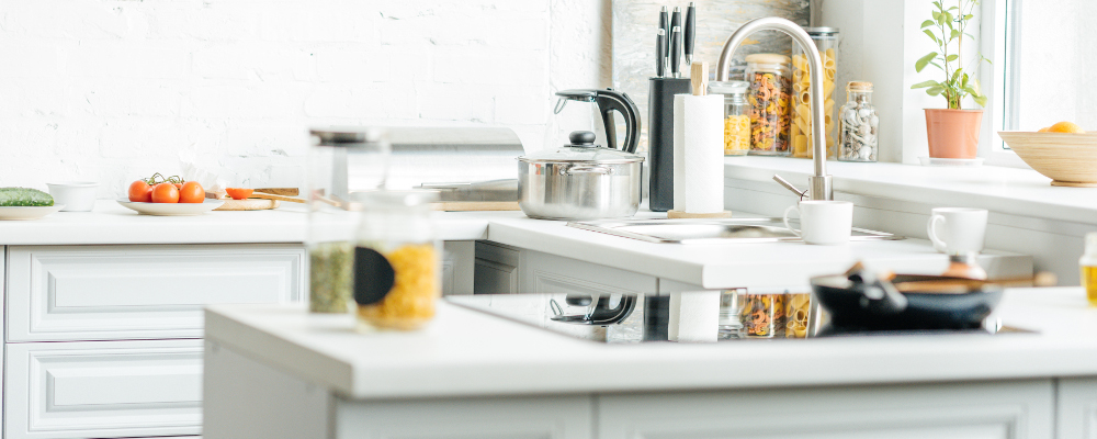 fully stocked kitchen with utensils and food ingredients on kitchen countertop