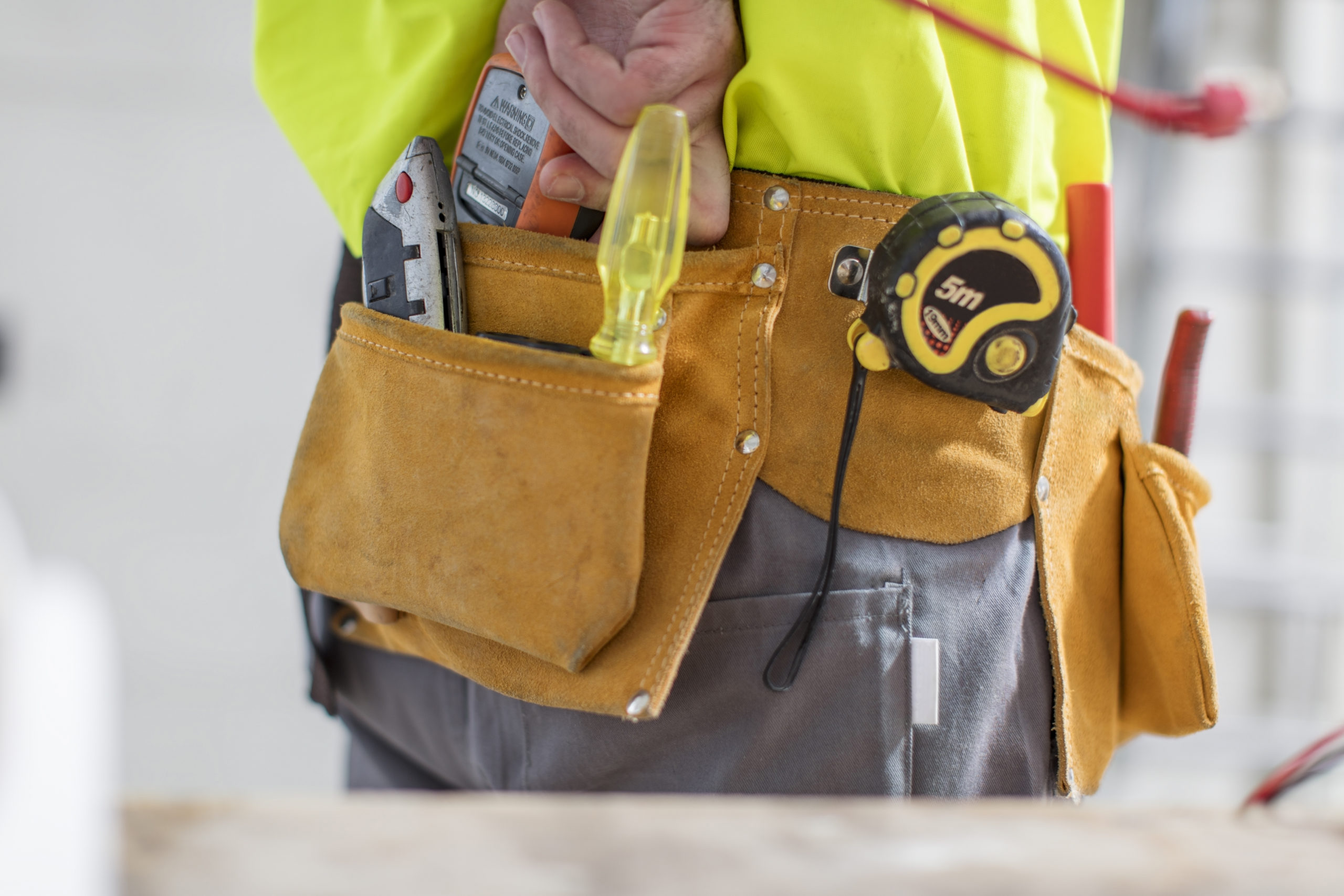 Close-up of construction worker with tool belt