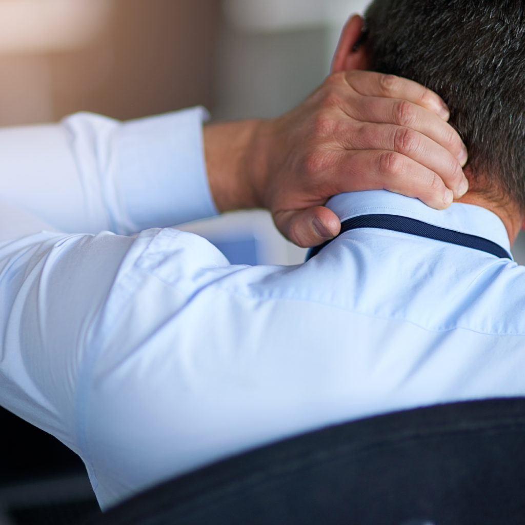 Having the worst day at work. Shot of a businessman suffering from neck pain